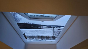 Attic floor with views over fields and sea, Sigtuna